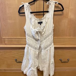 White lacy tunic with button closure up the front = NWT not worn
